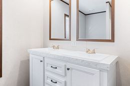 The BREEZE FARMHOUSE 72 Guest Bathroom. This Manufactured Mobile Home features 4 bedrooms and 2 baths.