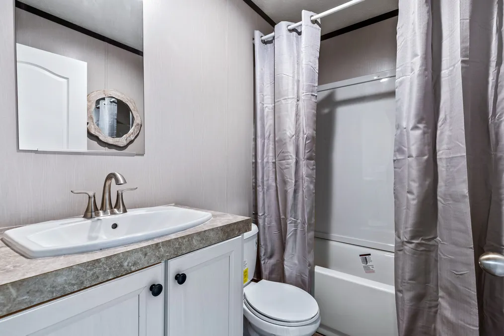 The DESIRE Guest Bathroom. This Manufactured Mobile Home features 3 bedrooms and 2 baths.