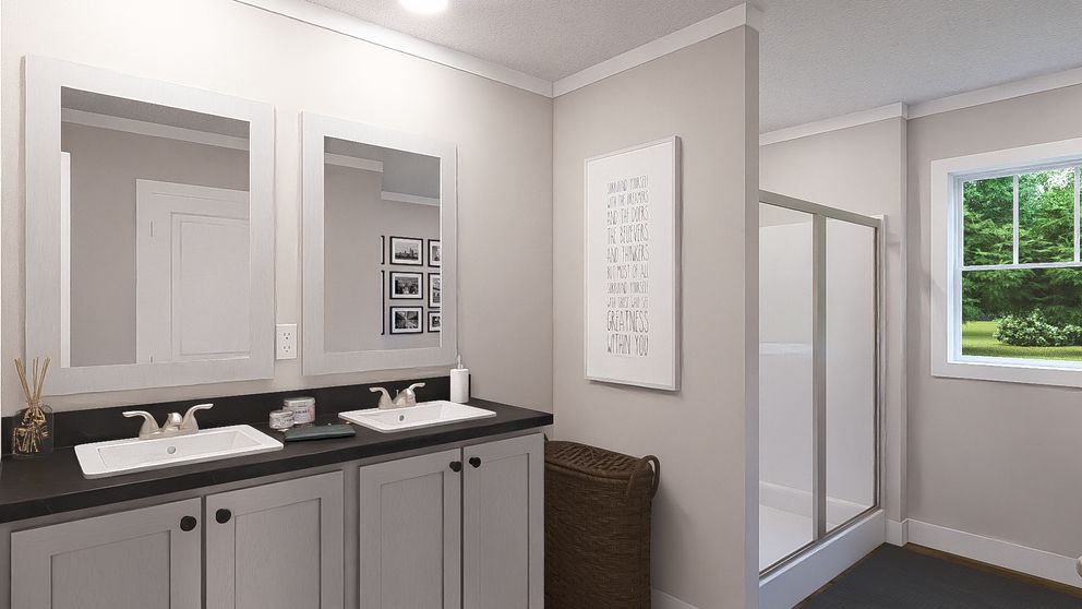 The LEAN ON ME Primary Bathroom. This Manufactured Mobile Home features 3 bedrooms and 2 baths.
