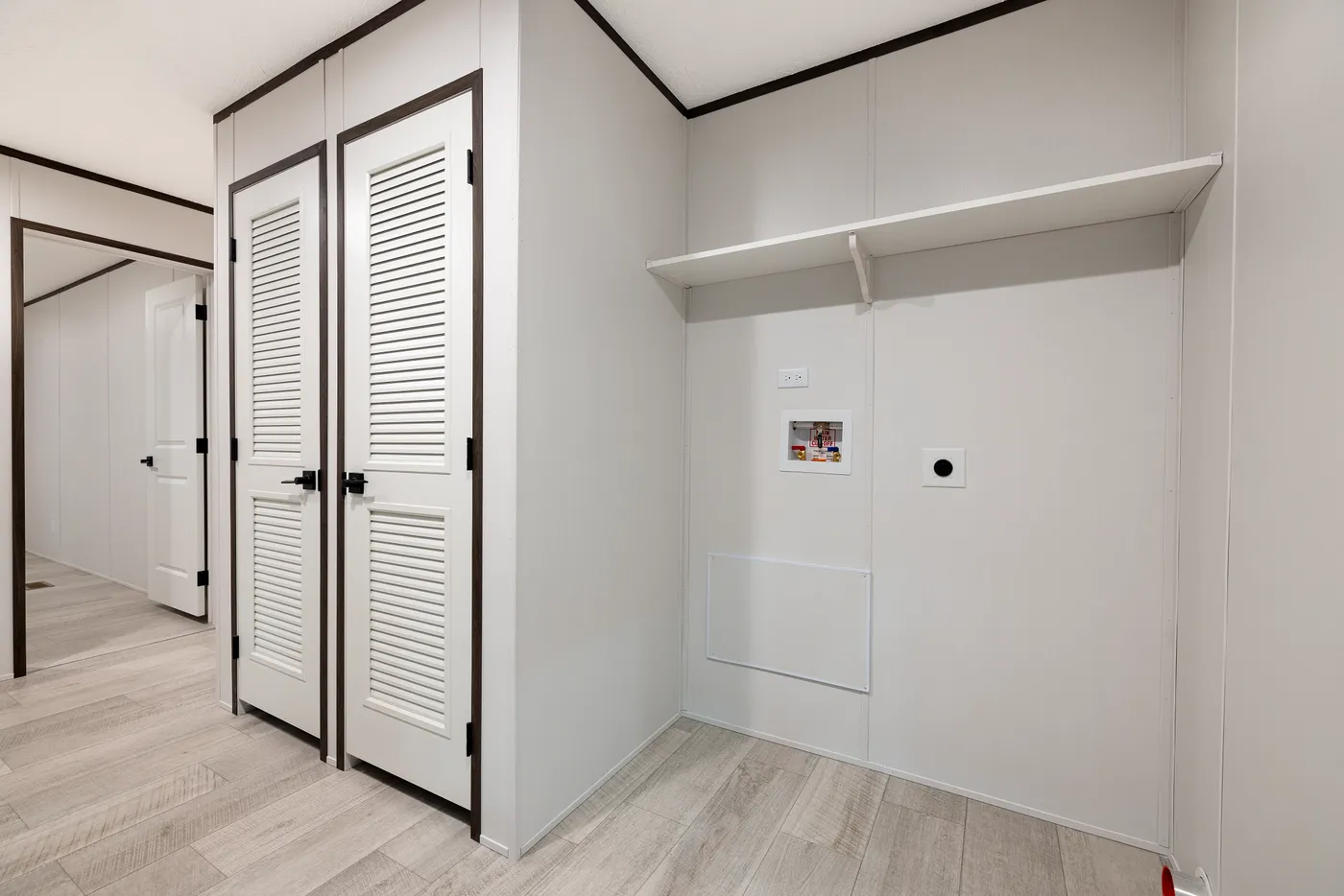 The CRESTWOOD Utility Room. This Manufactured Mobile Home features 3 bedrooms and 2 baths.