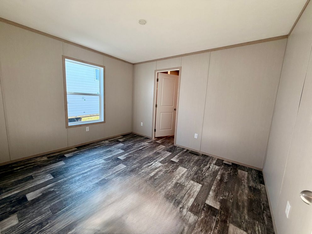 The JEFFERSON Primary Bedroom. This Manufactured Mobile Home features 3 bedrooms and 2 baths.