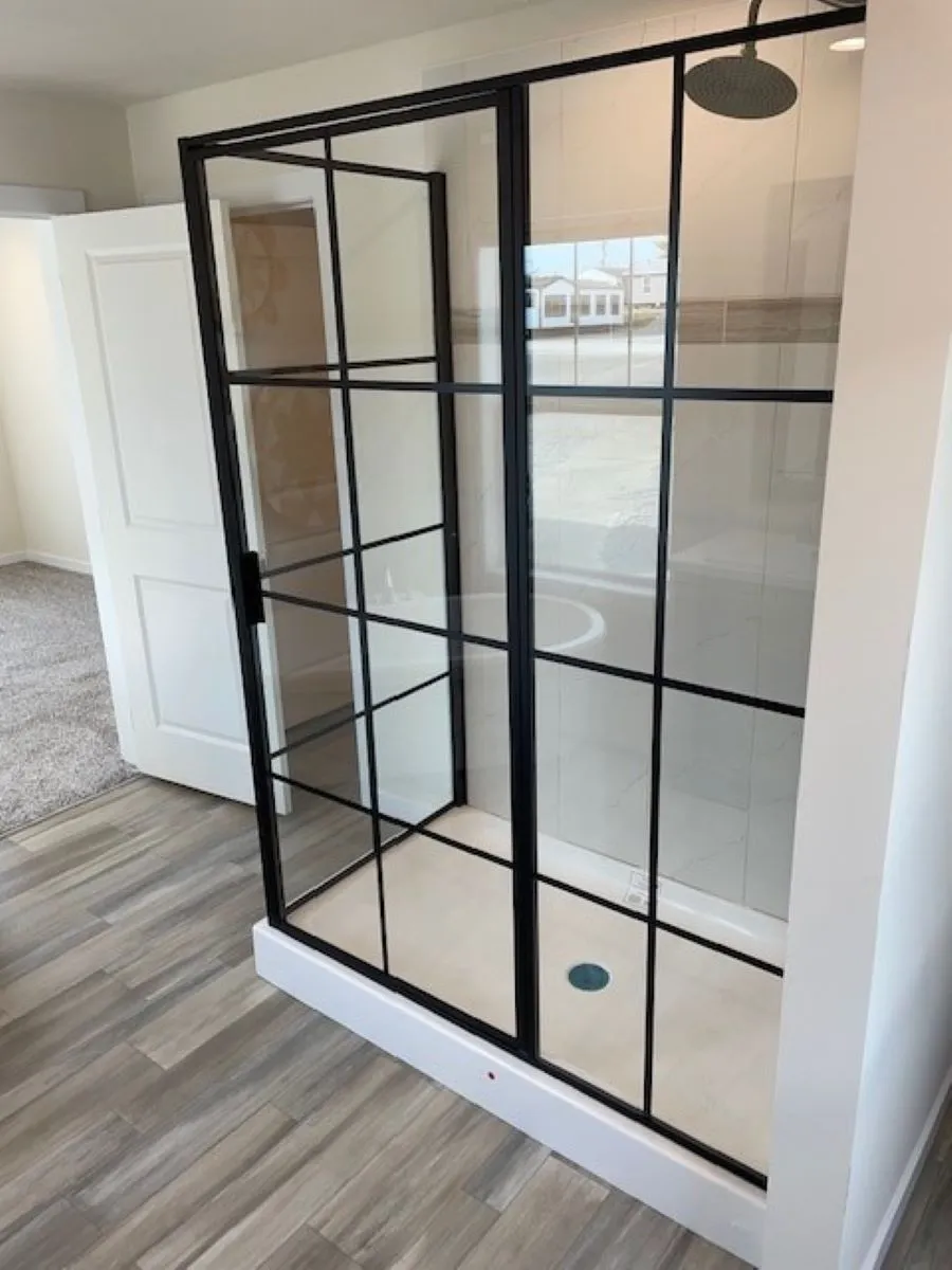 The BUTLER PLACE/6428-MS056 SECT Primary Bathroom. This Manufactured Mobile Home features 3 bedrooms and 3 baths.