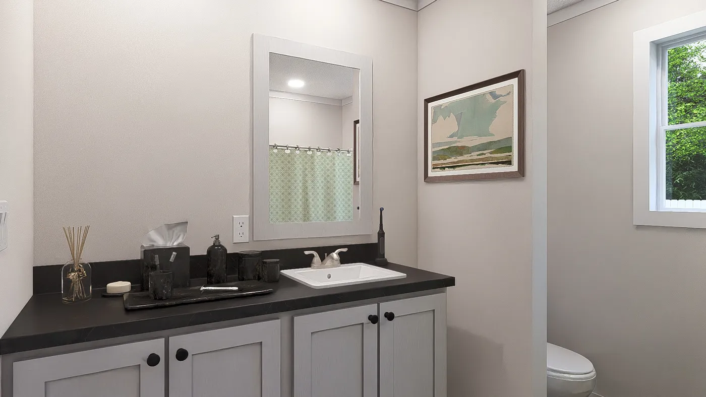 The HEY JUDE Guest Bathroom. This Manufactured Mobile Home features 4 bedrooms and 2 baths.