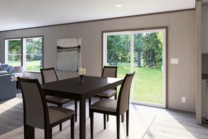 The LEGEND BIG BOY Dining Room. This Manufactured Mobile Home features 4 bedrooms and 2 baths.