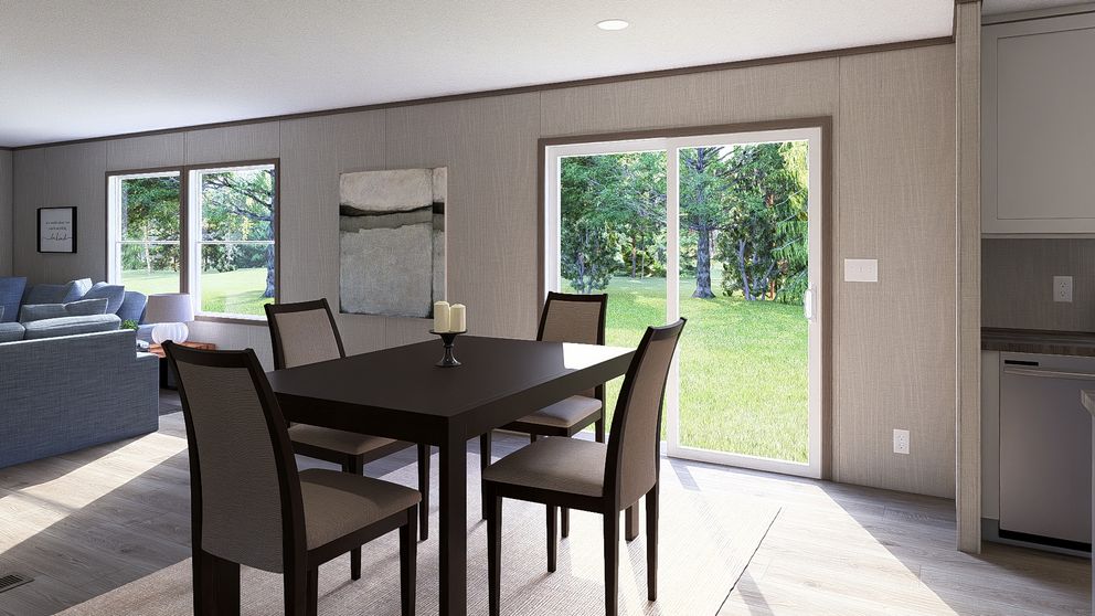 The LEGEND BIG BOY Dining Room. This Manufactured Mobile Home features 4 bedrooms and 2 baths.
