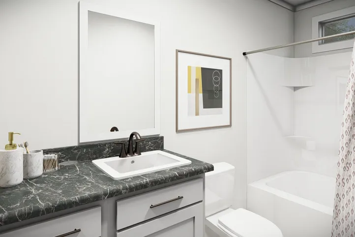 The THE PARKER Guest Bathroom. This Manufactured Mobile Home features 3 bedrooms and 2 baths.