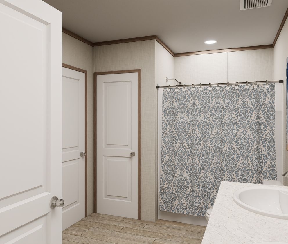 The ULTRA FLEX 60 Primary Bathroom. This Manufactured Mobile Home features 3 bedrooms and 2 baths.