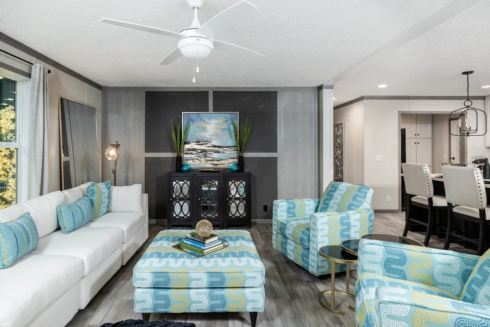 The 6428-E792 THE PULSE Living Room. This Manufactured Mobile Home features 3 bedrooms and 2.5 baths.