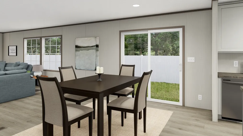 The LEGEND BIG BOY Dining Area. This Manufactured Mobile Home features 4 bedrooms and 2 baths.