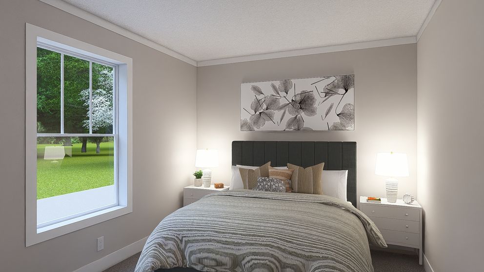 The WONDERFUL WORLD Guest Bedroom. This Manufactured Mobile Home features 3 bedrooms and 2 baths.