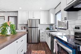 The THE REAL DEAL Kitchen. This Manufactured Mobile Home features 3 bedrooms and 2 baths.