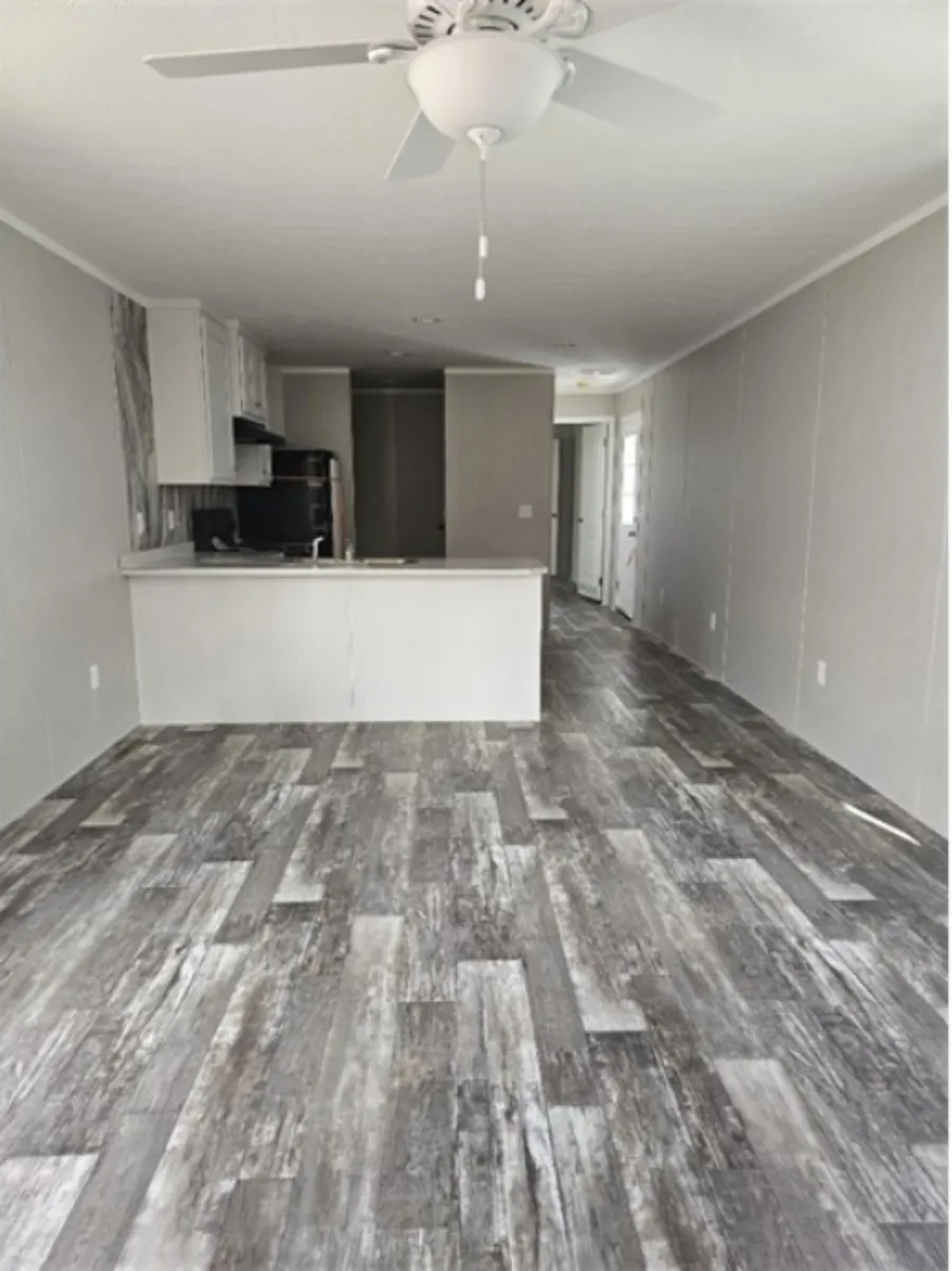 The TOPAZ Living Room. This Manufactured Mobile Home features 3 bedrooms and 2 baths.