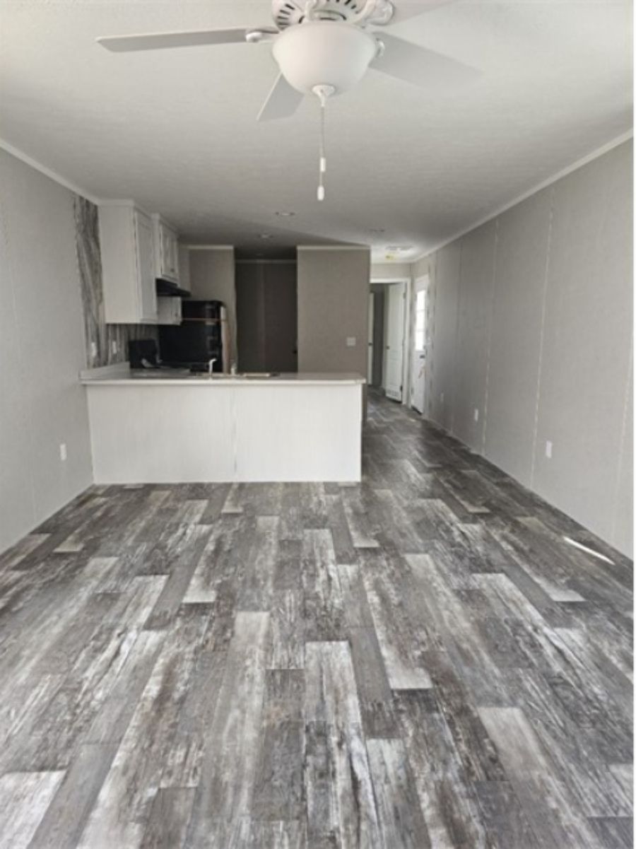 The TOPAZ Living Room. This Manufactured Mobile Home features 3 bedrooms and 2 baths.