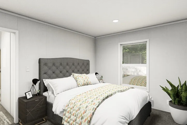 The RUBY Primary Bedroom. This Manufactured Mobile Home features 2 bedrooms and 2 baths.