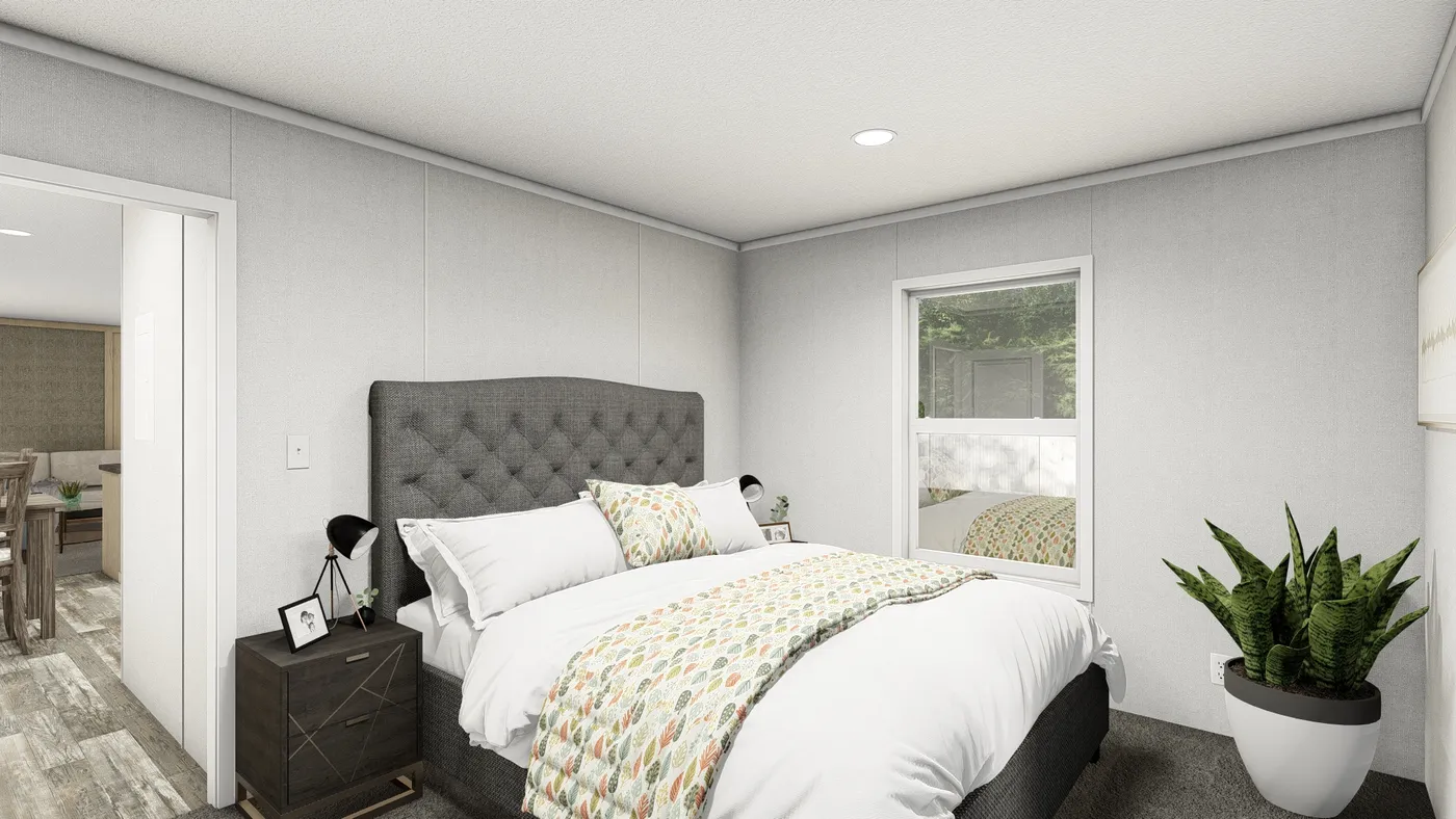 The RUBY Primary Bedroom. This Manufactured Mobile Home features 2 bedrooms and 2 baths.