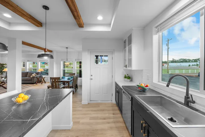 The LULAMAE 3 Kitchen. This Manufactured Mobile Home features 3 bedrooms and 2 baths.