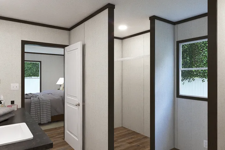 The EMPOWER Primary Bathroom. This Manufactured Mobile Home features 4 bedrooms and 2 baths.