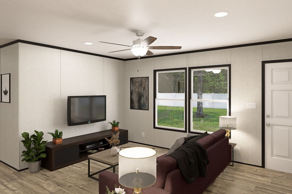 The THE MOUNTAINEER 48 Living Room. This Manufactured Mobile Home features 3 bedrooms and 2 baths.