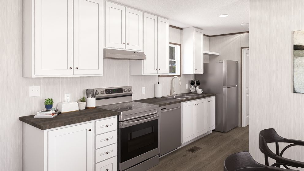 The LEGEND ANNIVERSARY 16X76 Kitchen. This Manufactured Mobile Home features 3 bedrooms and 2 baths.