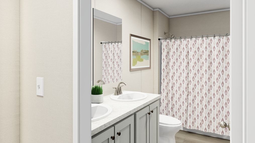 The LEGEND BIG BOY Primary Bathroom. This Manufactured Mobile Home features 4 bedrooms and 2 baths.