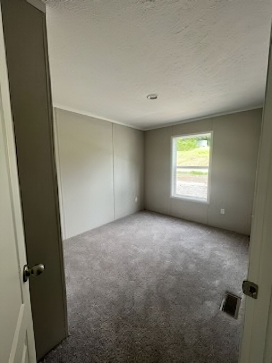 The JADE 48 Guest Bedroom. This Manufactured Mobile Home features 3 bedrooms and 2 baths.