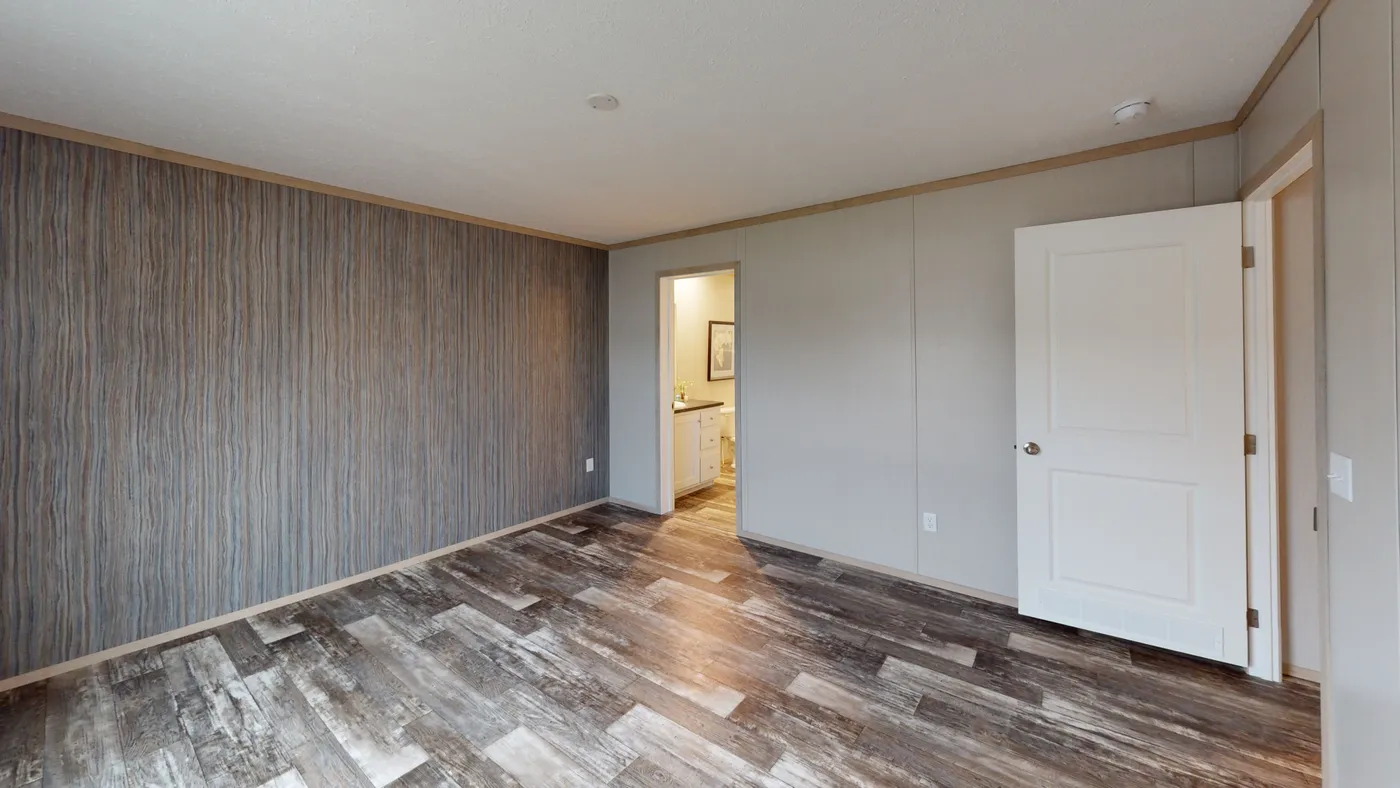The FRANKLIN Primary Bedroom. This Manufactured Mobile Home features 3 bedrooms and 2 baths.