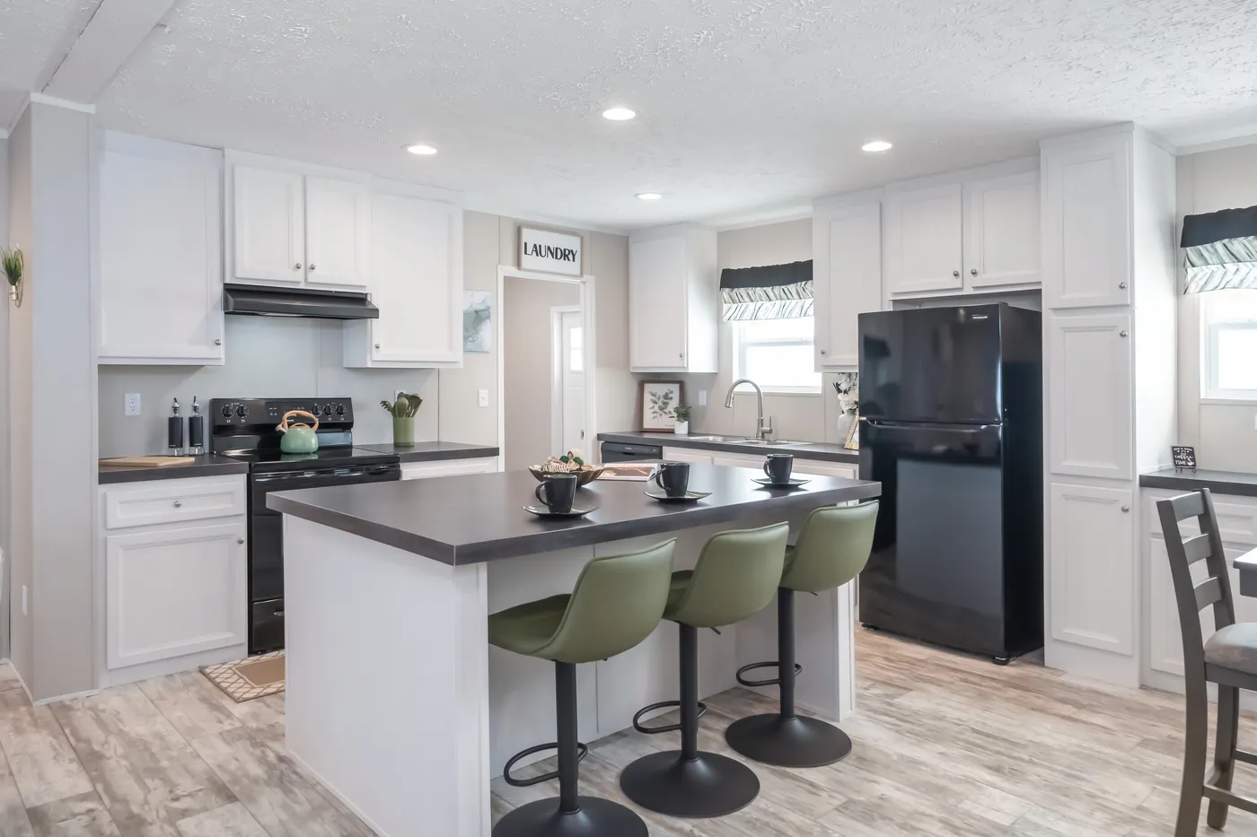 The BENJAMIN Kitchen. This Manufactured Mobile Home features 3 bedrooms and 2 baths.