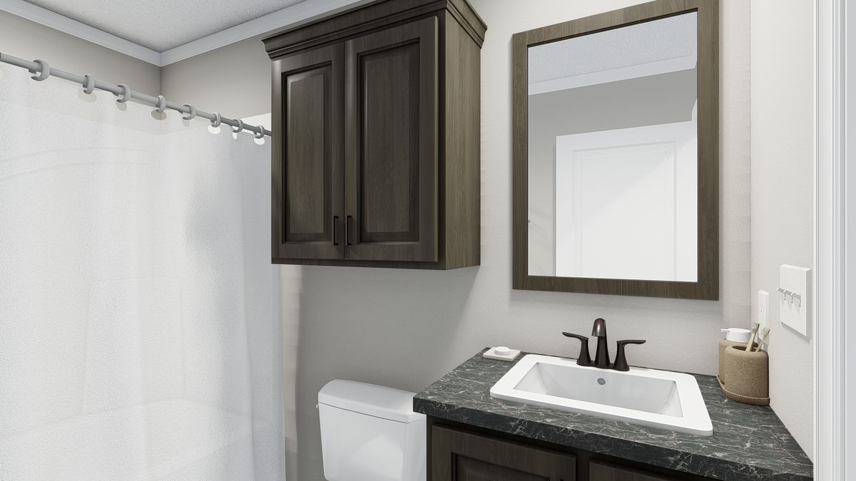 The THE LIL' EASY Guest Bathroom. This Manufactured Mobile Home features 3 bedrooms and 2 baths.