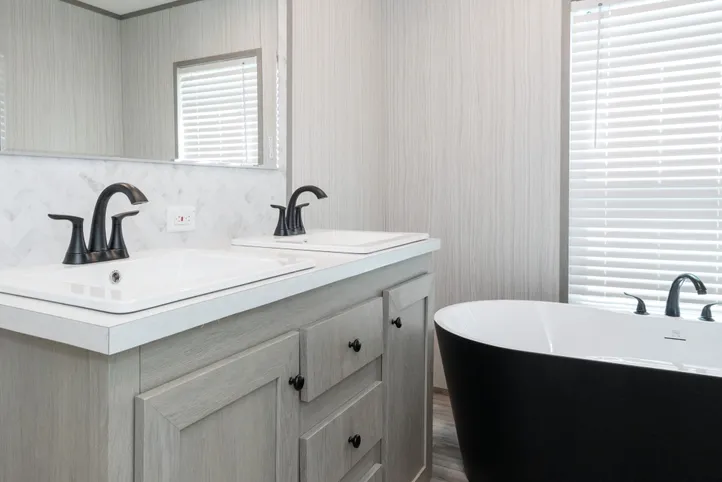 The THE ANNIVERSARY 76 Primary Bathroom. This Manufactured Mobile Home features 3 bedrooms and 2 baths.