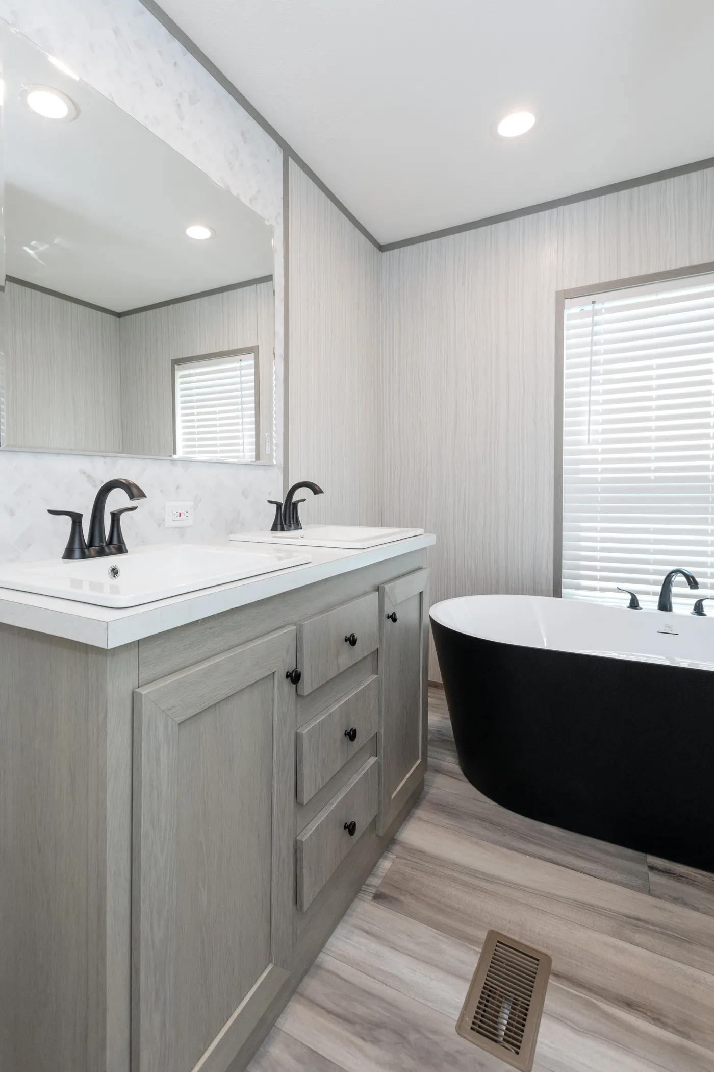 The THE ANNIVERSARY 76 Primary Bathroom. This Manufactured Mobile Home features 3 bedrooms and 2 baths.