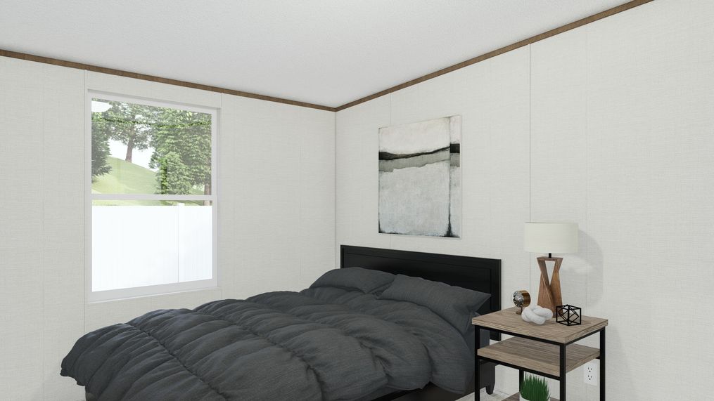 The EXCITEMENT Guest Bedroom. This Manufactured Mobile Home features 3 bedrooms and 2 baths.