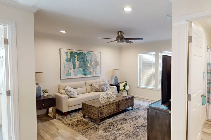 The 4215 "SUNRISE" 6428 Living Room. This Manufactured Mobile Home features 3 bedrooms and 2 baths.