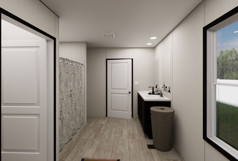 The ULTRA FLEX JEWEL GRANDE Primary Bathroom. This Manufactured Mobile Home features 4 bedrooms and 2 baths.