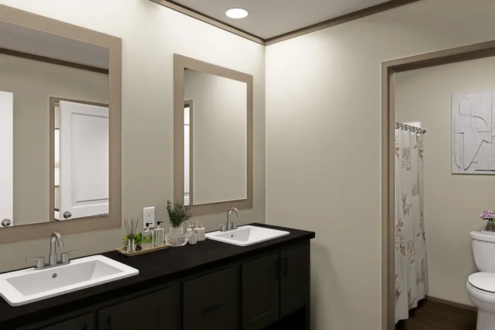 The RAINIER Guest Bathroom. This Manufactured Mobile Home features 4 bedrooms and 3 baths.
