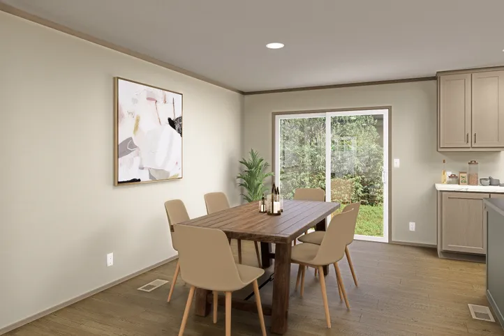The SUMMIT Dining Area. This Manufactured Mobile Home features 4 bedrooms and 3 baths.