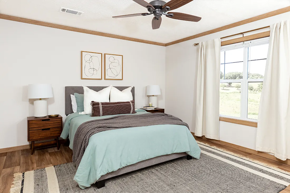 The ANGELINA Primary Bedroom. This Manufactured Mobile Home features 4 bedrooms and 2 baths.