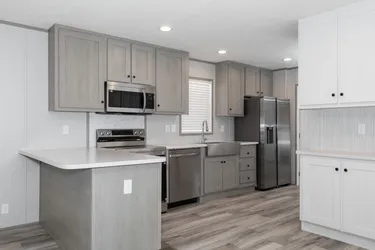 The THE ANNIVERSARY 76 Kitchen. This Manufactured Mobile Home features 3 bedrooms and 2 baths.
