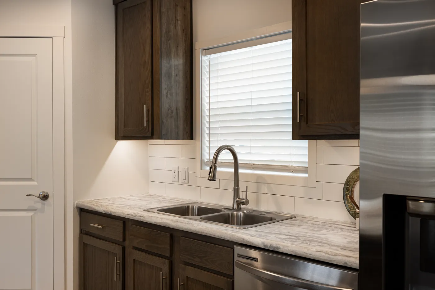 The RAMSEY 217-1 Kitchen. This Manufactured Mobile Home features 3 bedrooms and 2 baths.