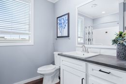 The THE ATLAS Guest Bathroom. This Manufactured Mobile Home features 4 bedrooms and 3 baths.