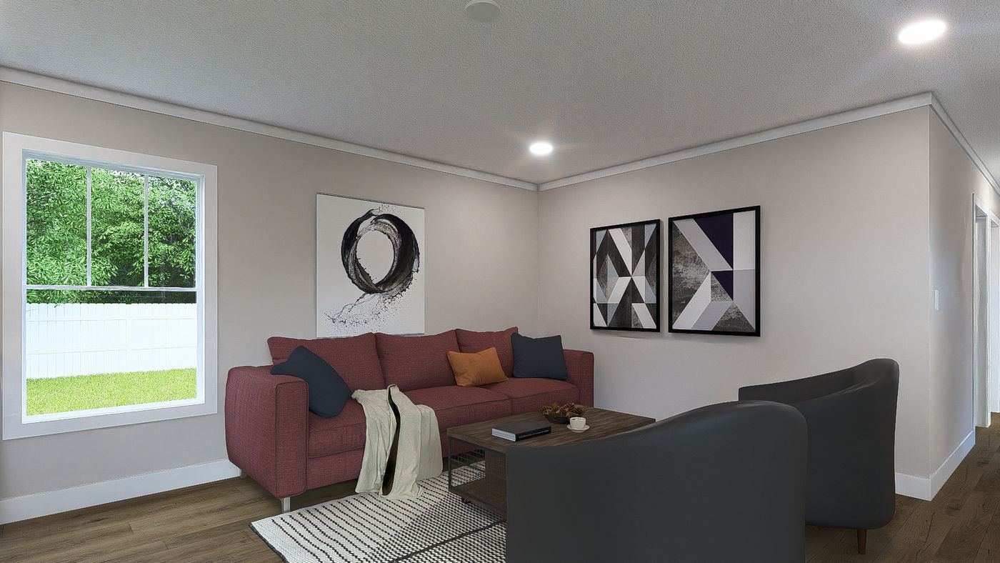 The SWEET CAROLINE Living Room. This Manufactured Mobile Home features 3 bedrooms and 2 baths.