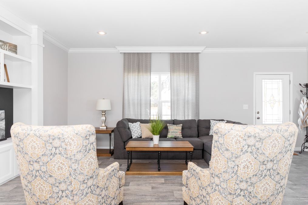 The SUPER 68 ELITE Living Room. This Manufactured Mobile Home features 3 bedrooms and 2 baths.