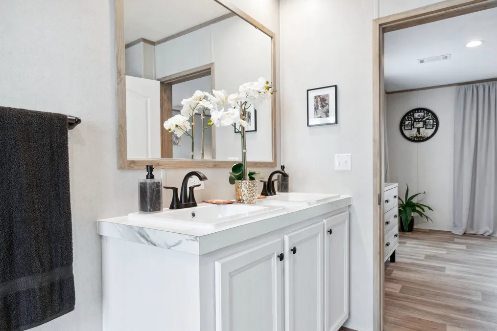 The THE REAL DEAL Primary Bathroom. This Manufactured Mobile Home features 3 bedrooms and 2 baths.