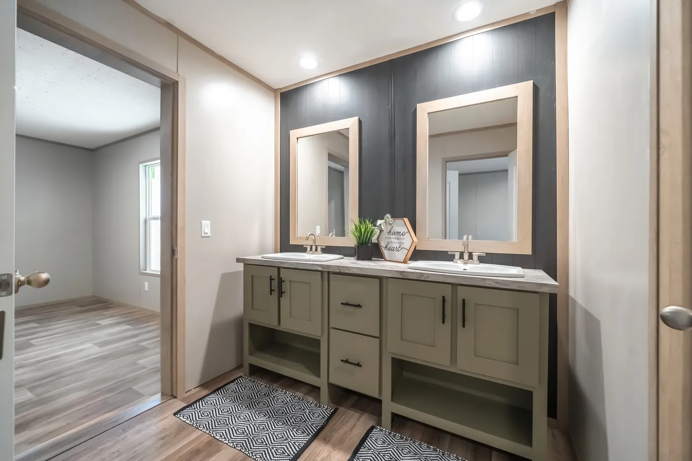 The RAINIER Primary Bathroom. This Manufactured Mobile Home features 4 bedrooms and 3 baths.