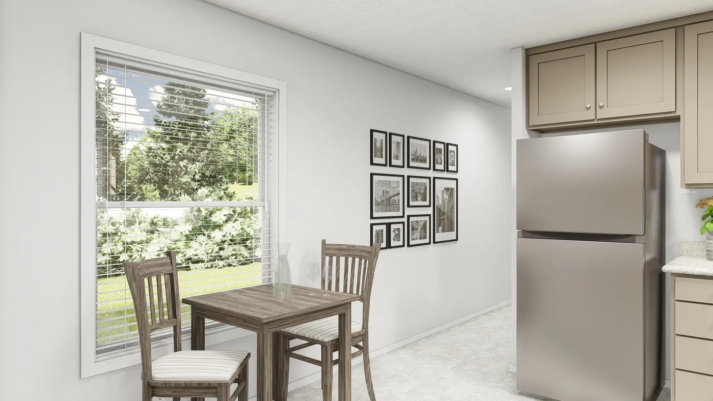 The DRM603N 1560'            DREAM Dining Area. This Manufactured Mobile Home features 2 bedrooms and 2 baths.