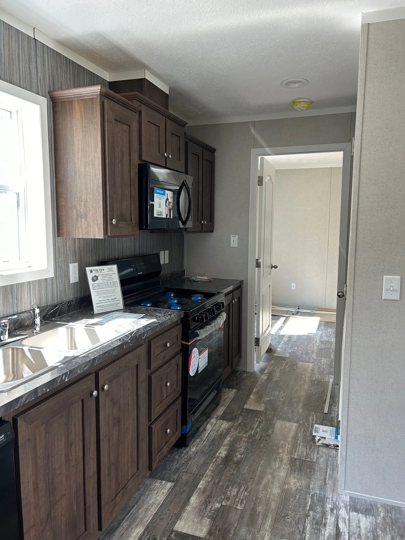 The SAPPHIRE XL 8016-644 Kitchen. This Manufactured Mobile Home features 3 bedrooms and 2 baths.