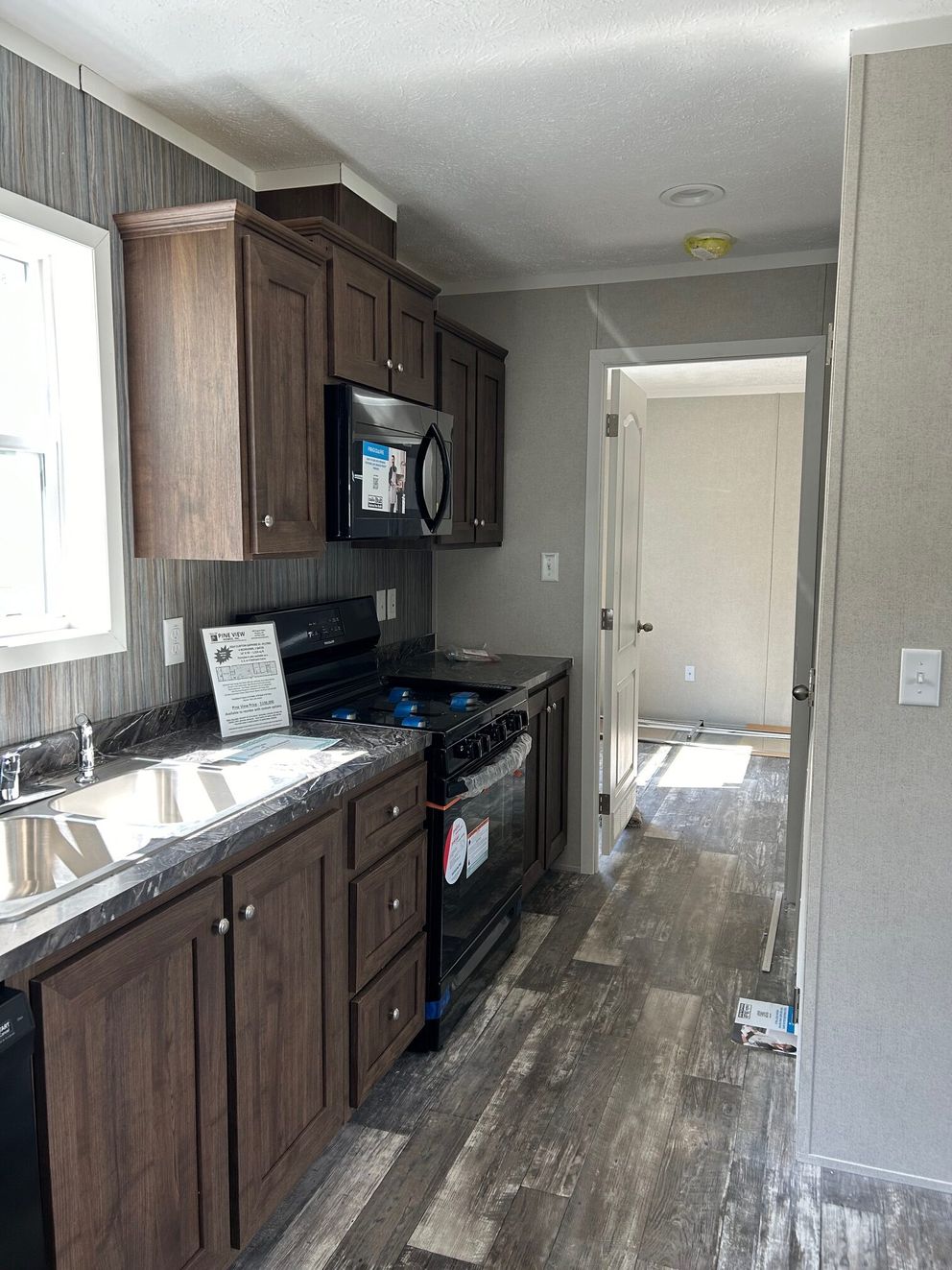 The SAPPHIRE XL 8016-644 Kitchen. This Manufactured Mobile Home features 3 bedrooms and 2 baths.