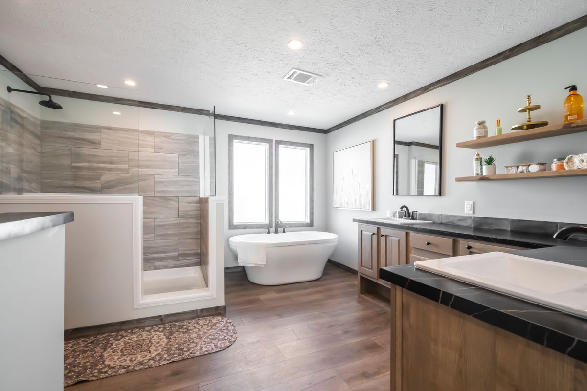 The THE JACKSON Primary Bathroom. This Manufactured Mobile Home features 4 bedrooms and 2 baths.