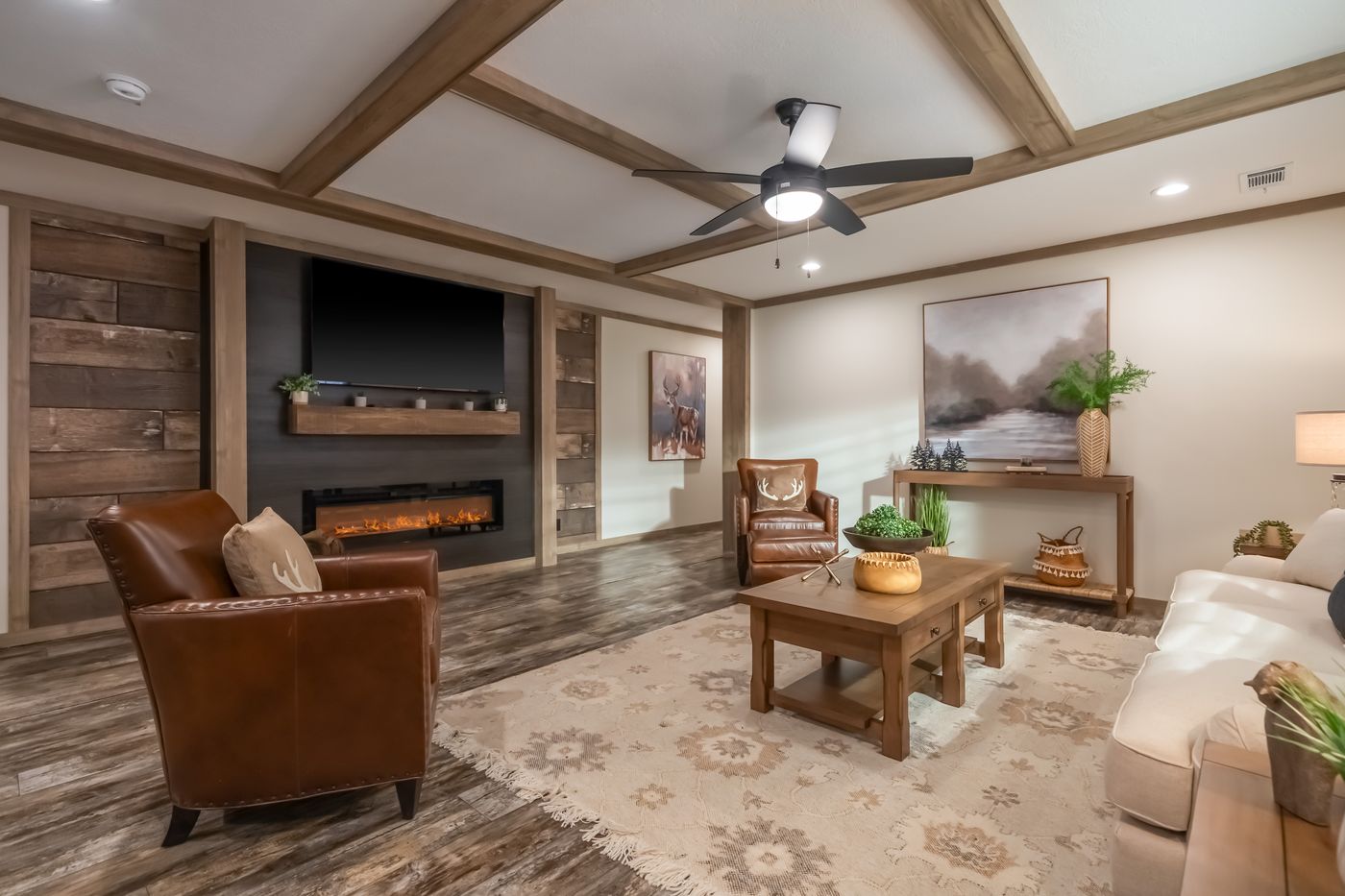 The BOUJEE PREMIER Living Room. This Manufactured Mobile Home features 4 bedrooms and 2 baths.