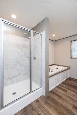 The FARM HOUSE 72 Primary Bathroom. This Manufactured Mobile Home features 4 bedrooms and 2 baths.