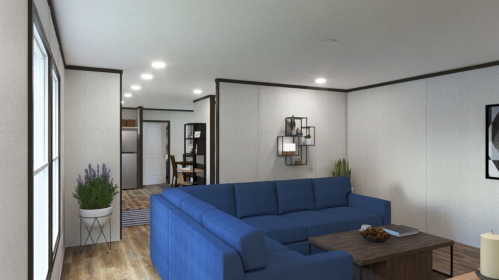 The GRAND Living Room. This Manufactured Mobile Home features 3 bedrooms and 2 baths.